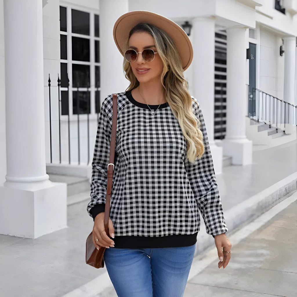 Black polyester pullover sweater with printed plaid and stripe pattern, long sleeves