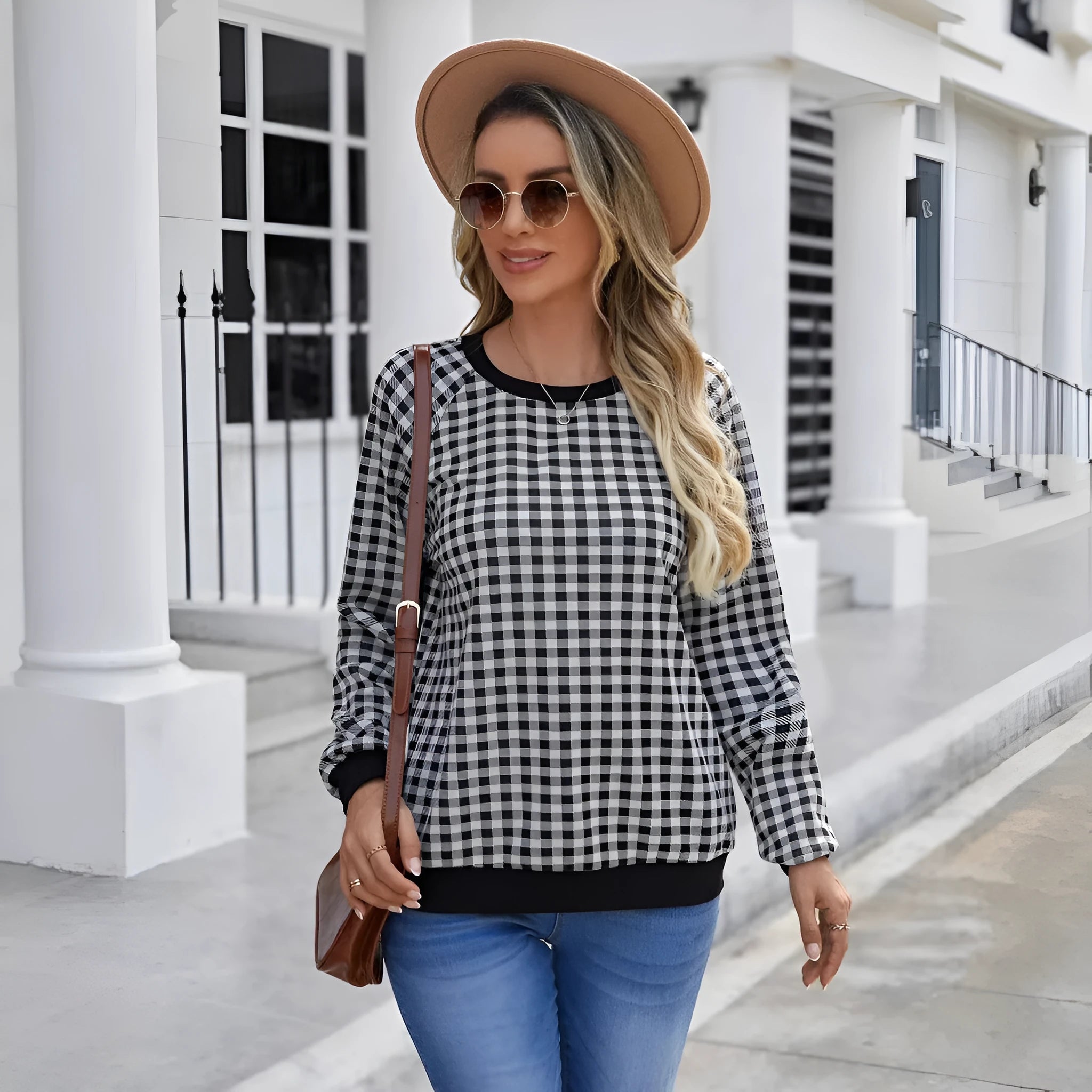 Black polyester pullover sweater with printed plaid and stripe pattern, long sleeves