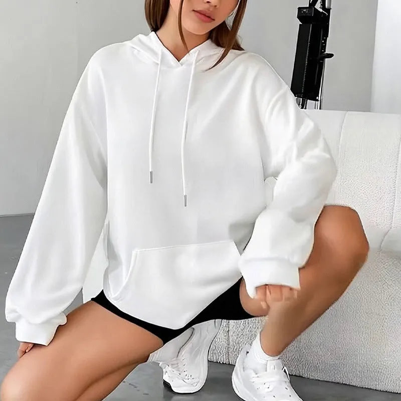 Women's loose grey sweatshirt with long sleeves and a front drawstring pocket.