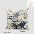 Blue abstract floral patterned decorative pillow on a sofa, showing square and rectangular sizes.