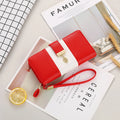 A locking anti-theft clutch handbag in PU leather, shown in midnight black, with dimensions 19.5 by 10.5 by 3.5 cm.