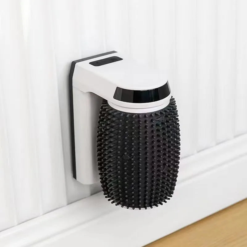 White automatic cat self-groomer brush mounted in a wall corner with soft silicone bristles.