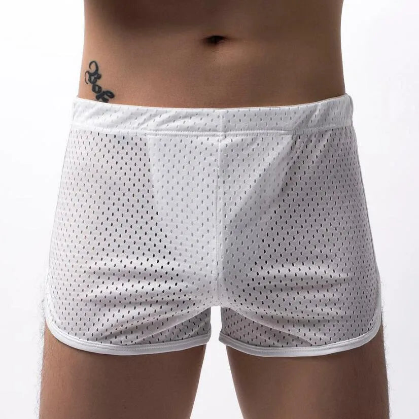 Men's three-point boxers in a cotton and nylon blend, shown in black, on a mid-waist fit model.