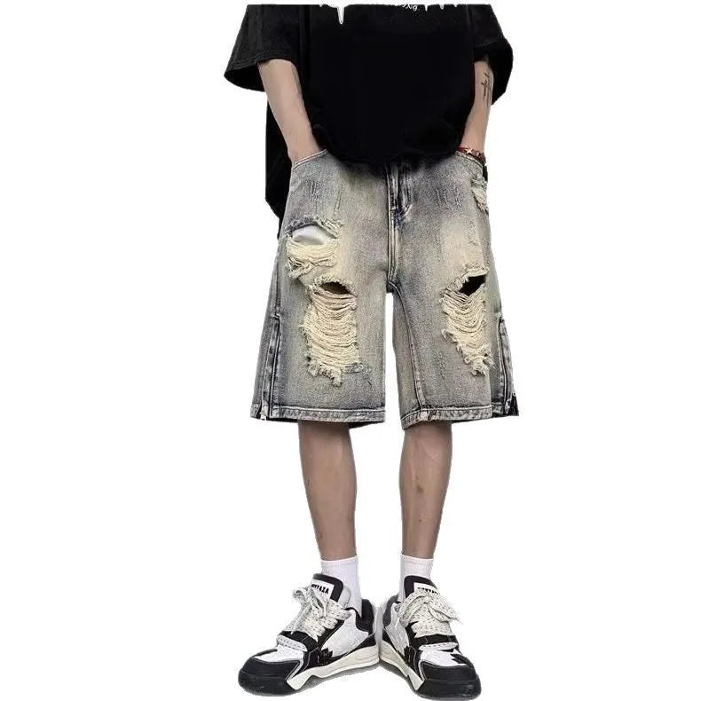 Blue retro tattered denim shorts with a wide leg loose fit on a person