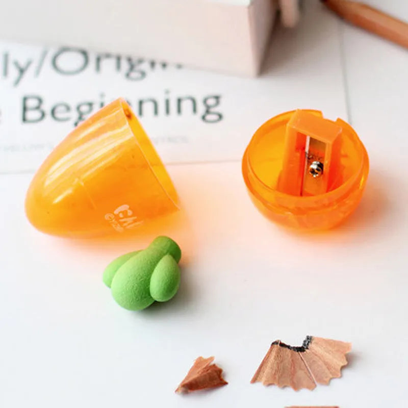 Orange carrot-shaped plastic pencil sharpener with 7cm handle length