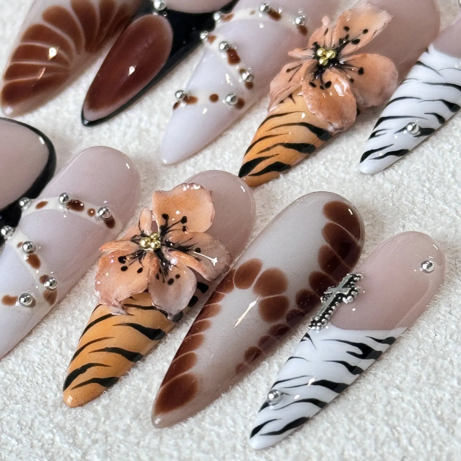 Handmade French style leopard print nail armour stickers with cross and flower patterns.