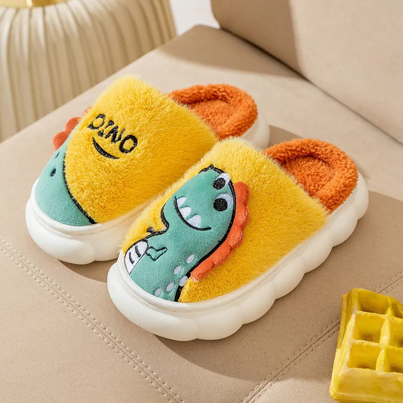 Pair of plush cotton dinosaur print slippers with a thickened sole, shown in magic grey colour.