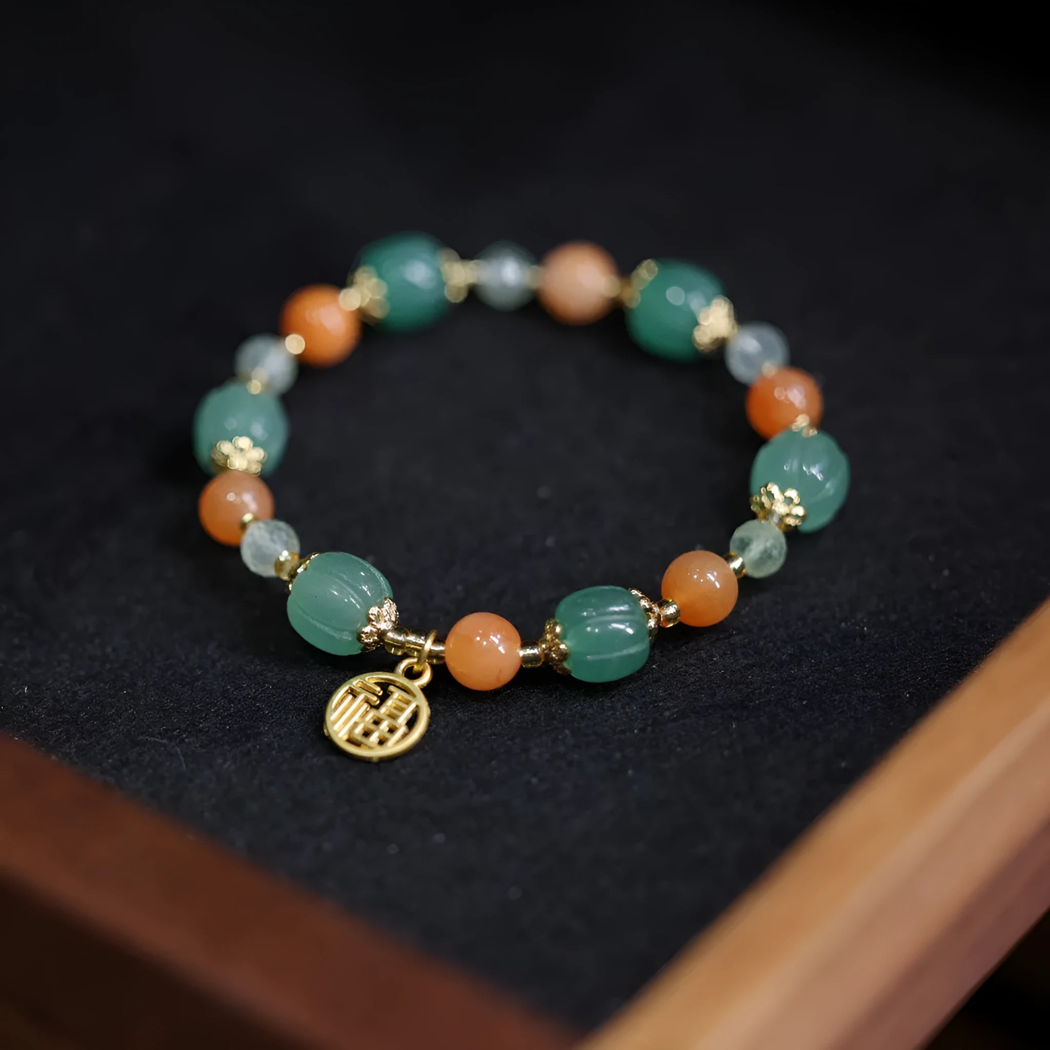 Traditional Chinese Duobao pumpkin bracelet with Jinsi Jade barrel beads and Prehnite accents