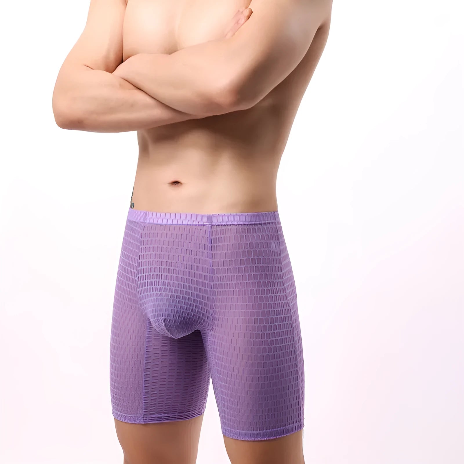 A pair of transparent men's lace boxers in a lengthened cut on a mid waist, shown in one of five available colours.