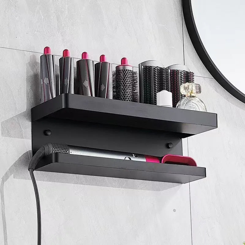 White two-layer aluminium punch-free bathroom storage rack mounted on a wall holding hair curlers.