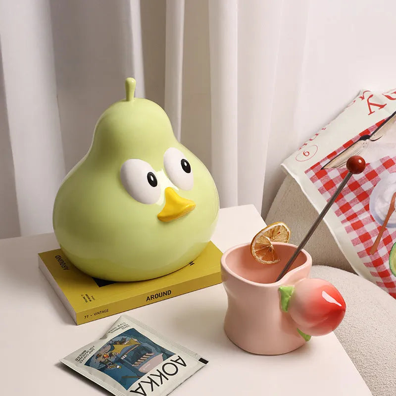 Ceramic pear-shaped tissue box in animal style design available in green or black colour