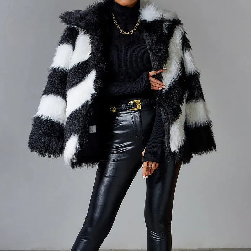 Women's faux fur coat with contrast colour lapel and matching fur collar on a model.