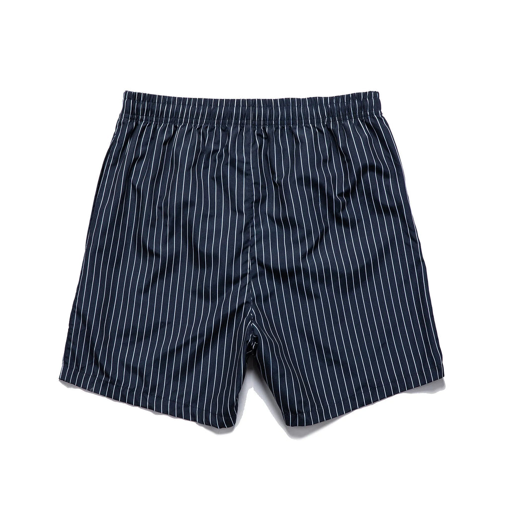 Men's navy blue and grey striped beach shorts with straight legs and built-in lining, laid flat.