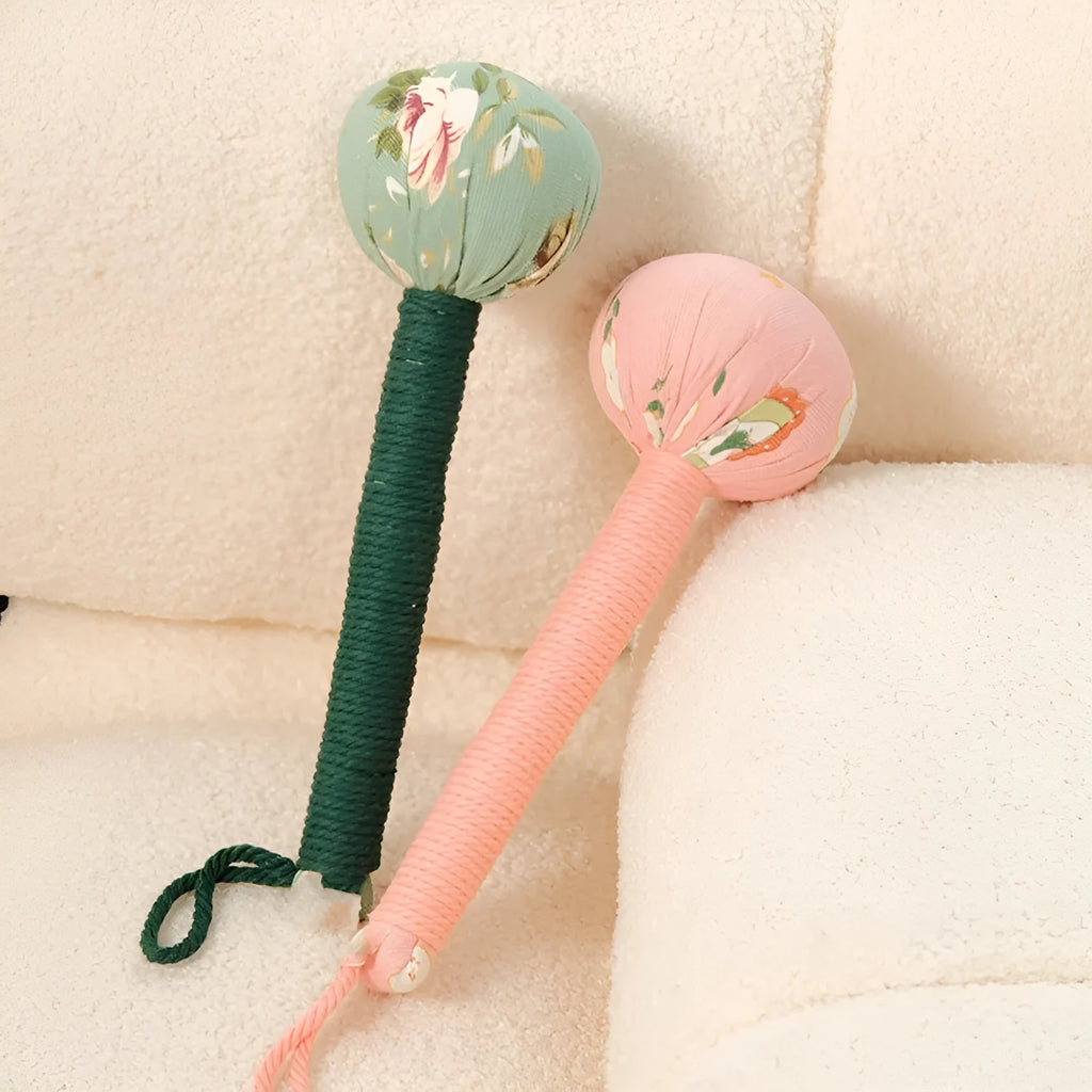 Argy wormwood handheld massage hammer in green colour on a plain background