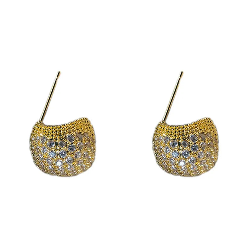 Golden bean earrings with diamond-cut detailing and ear clip fastening in drop shape
