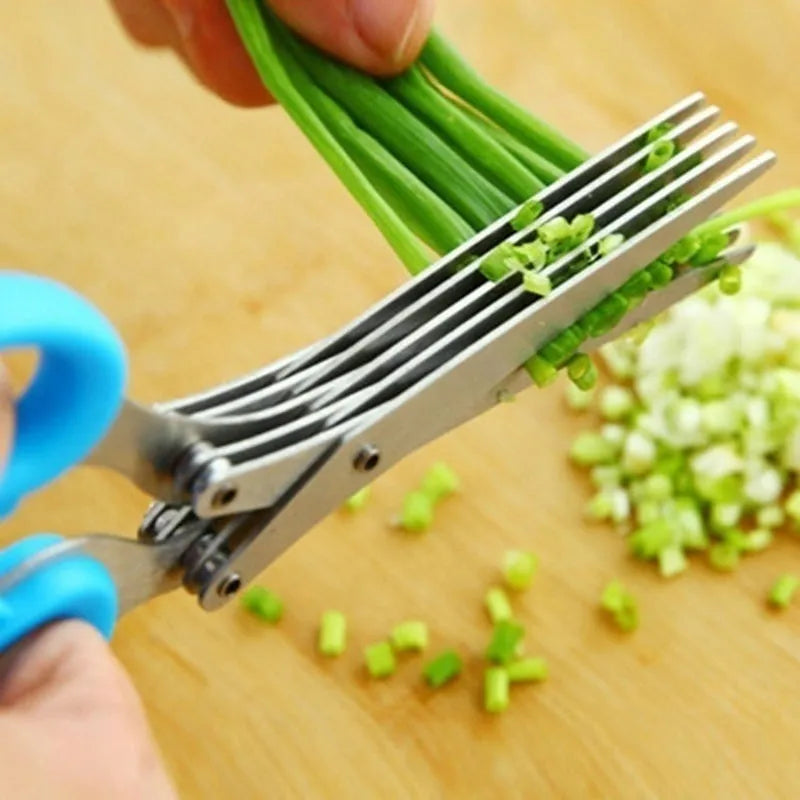 Stainless steel multi-layer herb scissors with green handles for chopping green onions and seaweed.