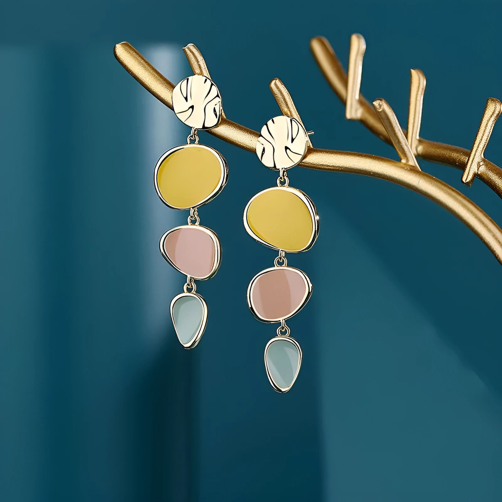 Morandi three-colour dripping oil finish alloy disc earrings on a sterling silver post.