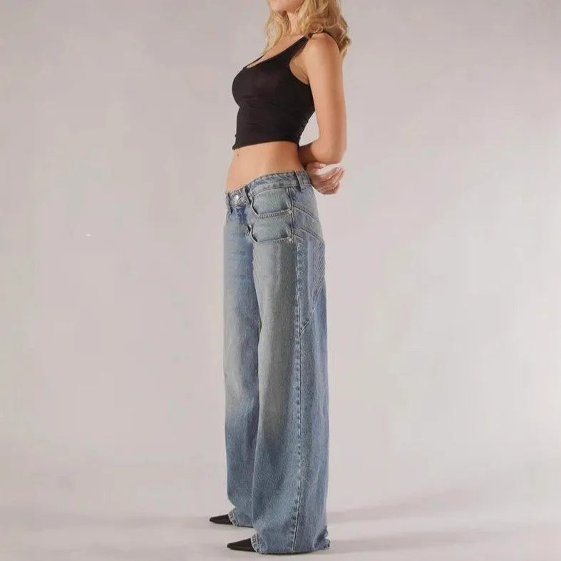 Women's loose blue cotton wide leg trousers with colour block panelling on a low waist.