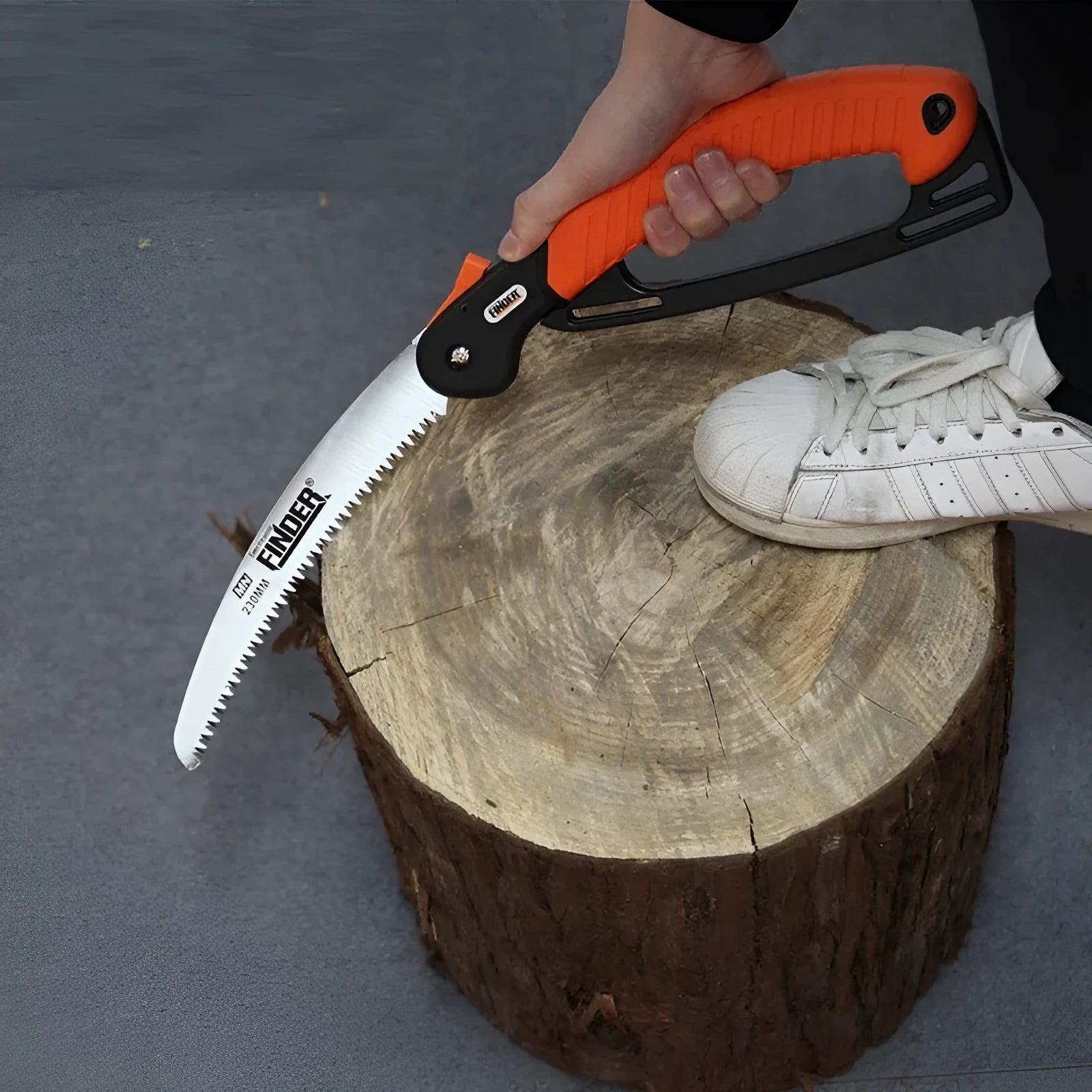A folded garden hand saw with a TPR grip and a 9-inch 65MN steel blade.