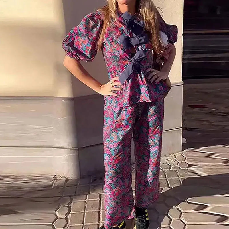 Women's floral printed polyester trousers suit with puff sleeves and tie-neck detail