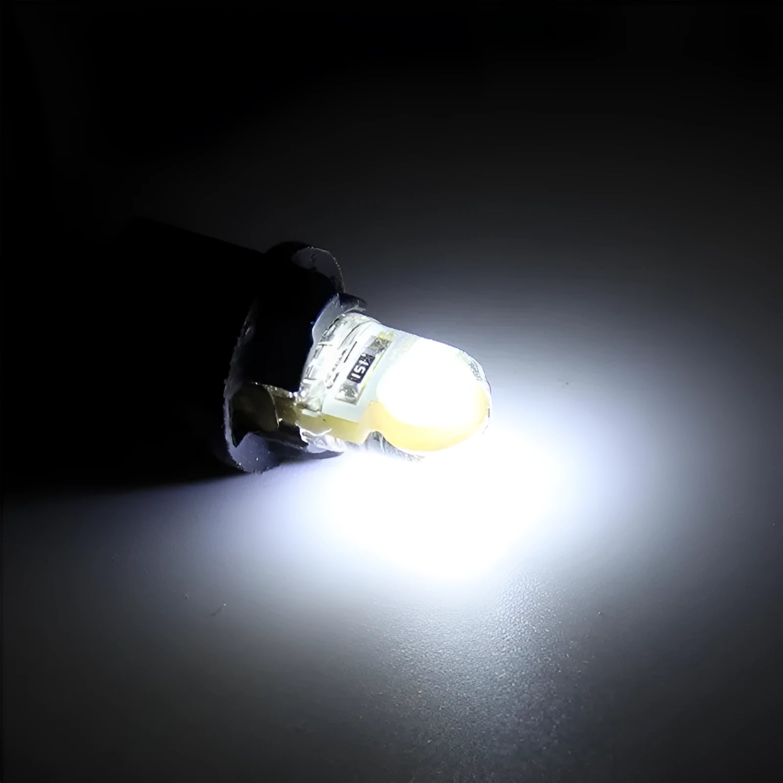 Pack of ten T10 wedge base LED bulbs for 12V car lighting in various colours on a white background.