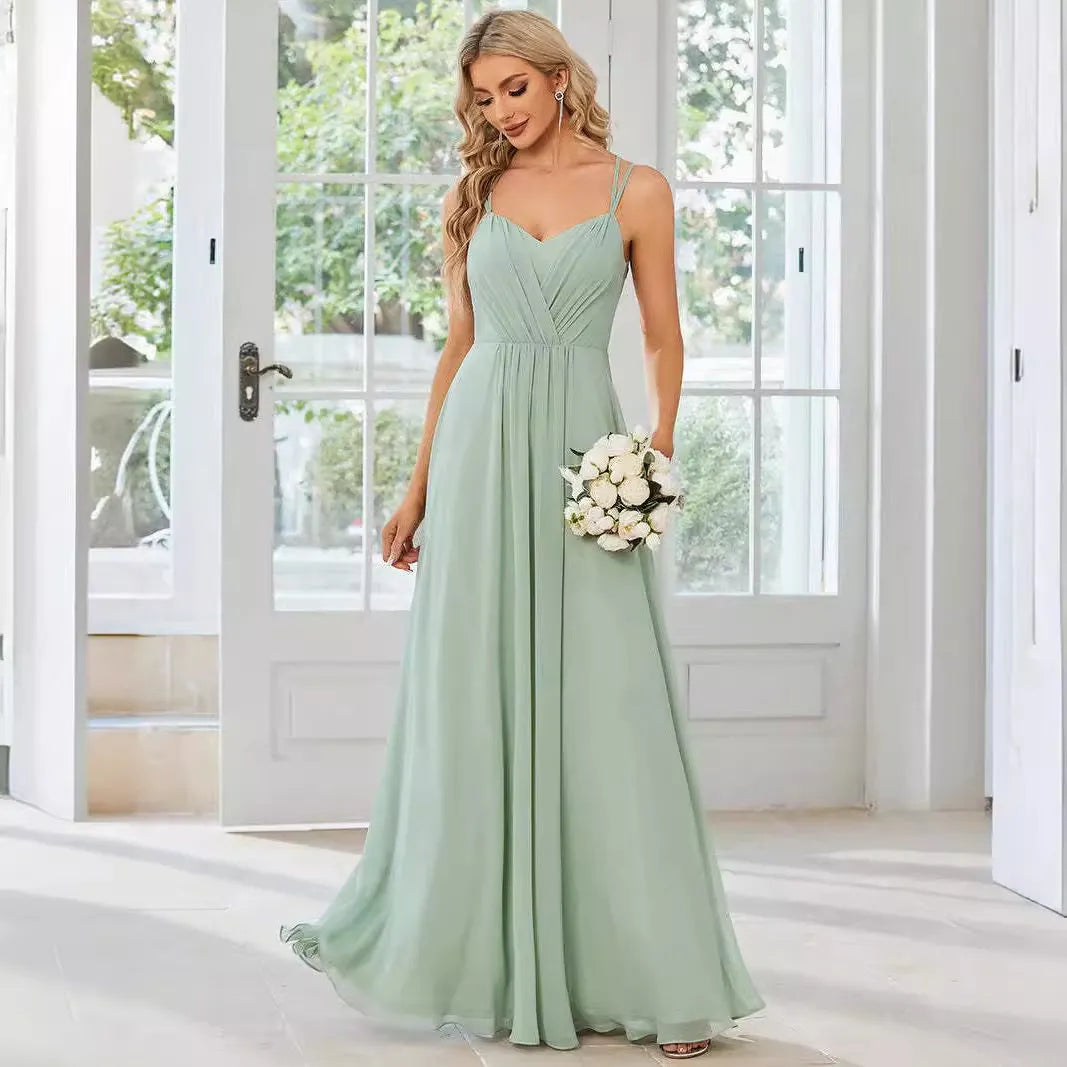 Women's sleeveless long dress with pleated detail and an A-line skirt in a light green colour.