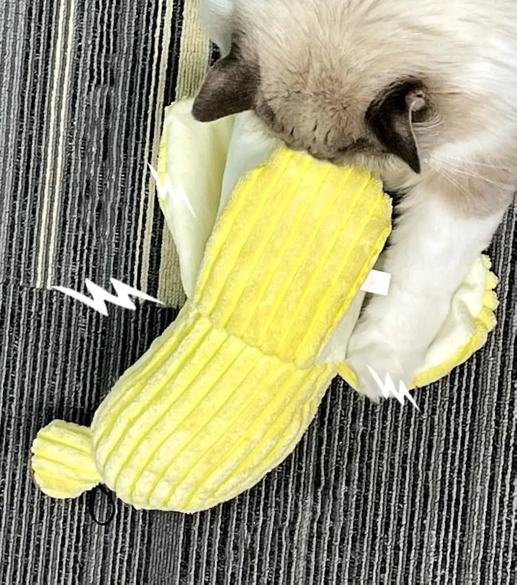 Yellow banana-shaped cat toy with textured surface for cats to chew and kick