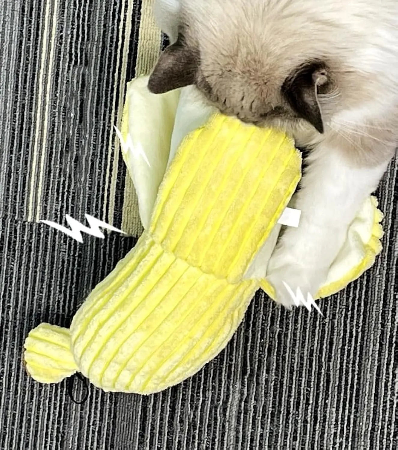 Yellow banana-shaped cat toy with textured surface for cats to chew and kick