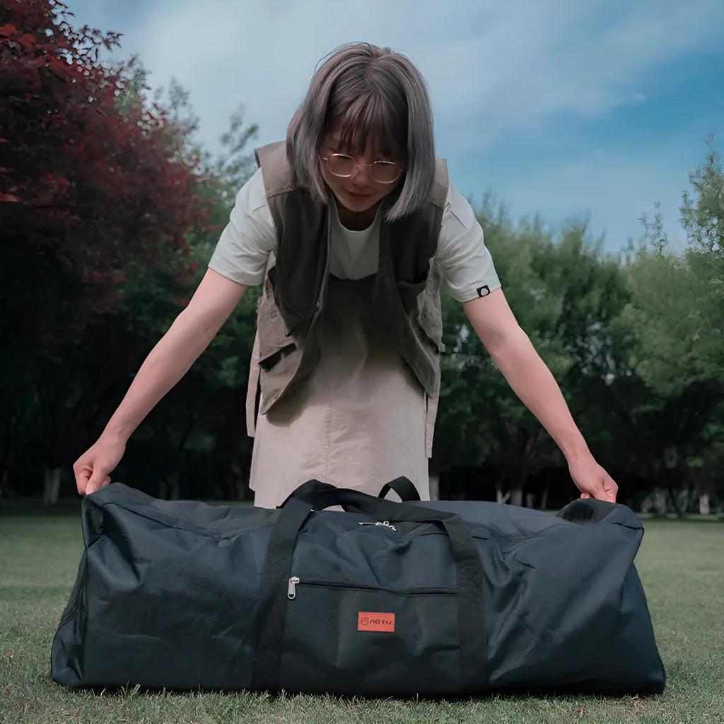 Green waterproof camping storage bag shown expanded and folded, with tents and chairs organised inside
