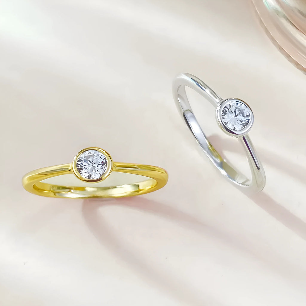 Minimalist sterling silver ring with crown shape and engraved line detail in gold or platinum finish