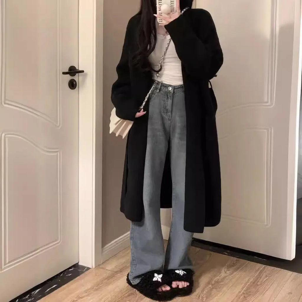 Women's khaki knitted v-neck cardigan with long sleeves on a hanger.