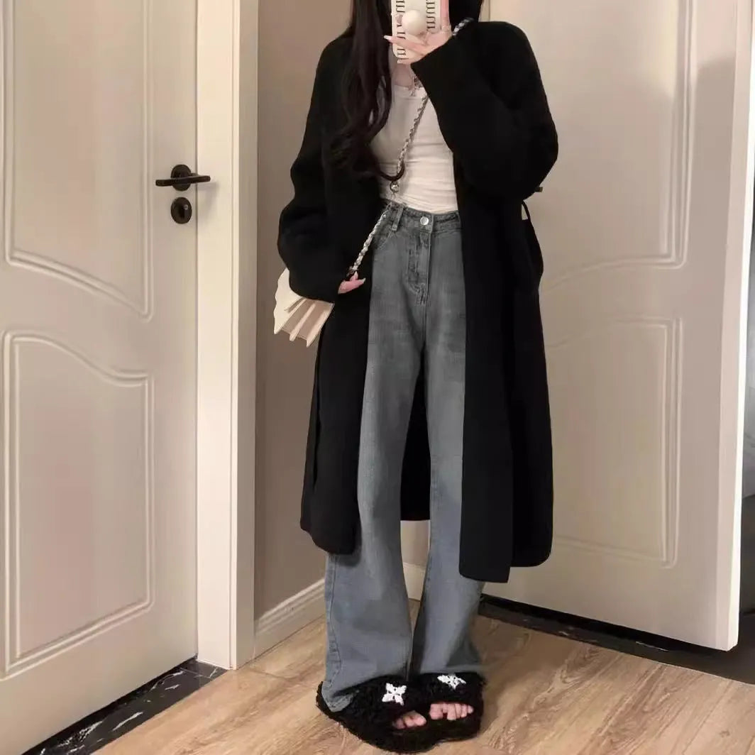 Women's khaki knitted v-neck cardigan with long sleeves on a hanger.