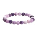 Handcrafted purple natural stone elastic bead bracelet with geometric beads.