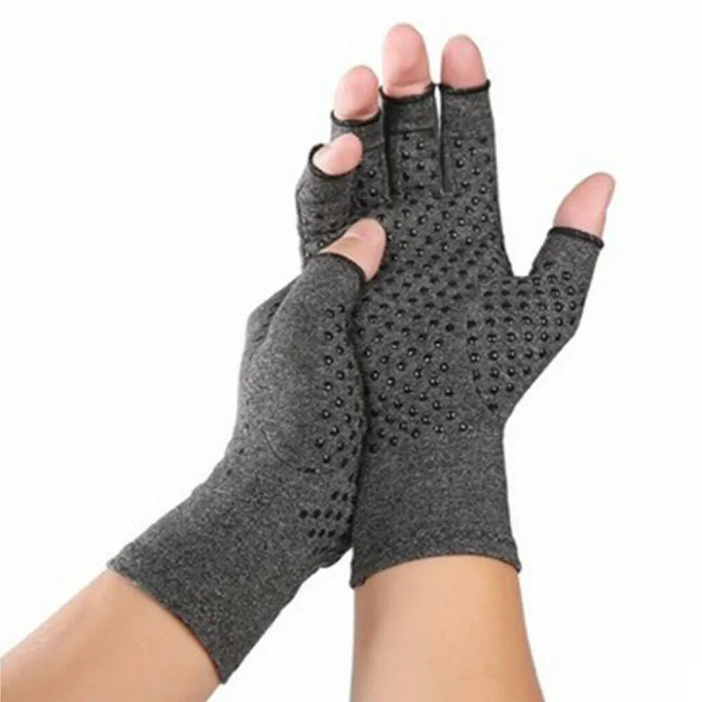 Grey half-finger compression gloves with silicone grip palm on hand, showing open fingertips.