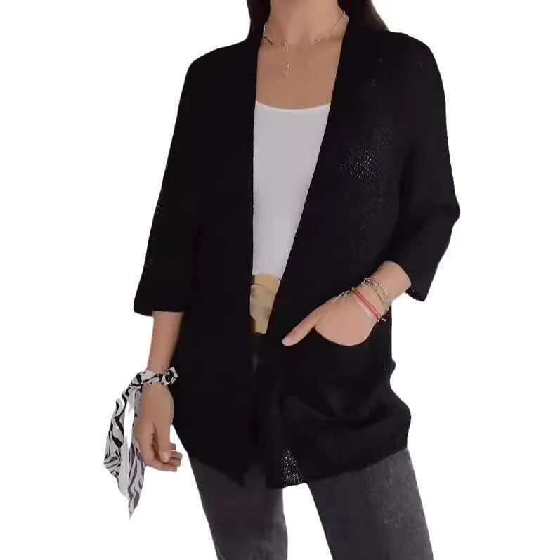 Women's army green waffle knit cardigan coat with nine-quarter length sleeves and pockets.