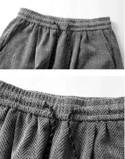 Light grey straight-leg hollow-out trousers with an elastic waistband, shown laid flat.