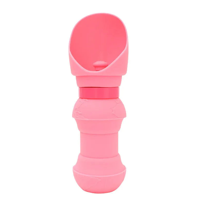 A folded and unfolded pink silicone water cup for dogs, showing its portable design.