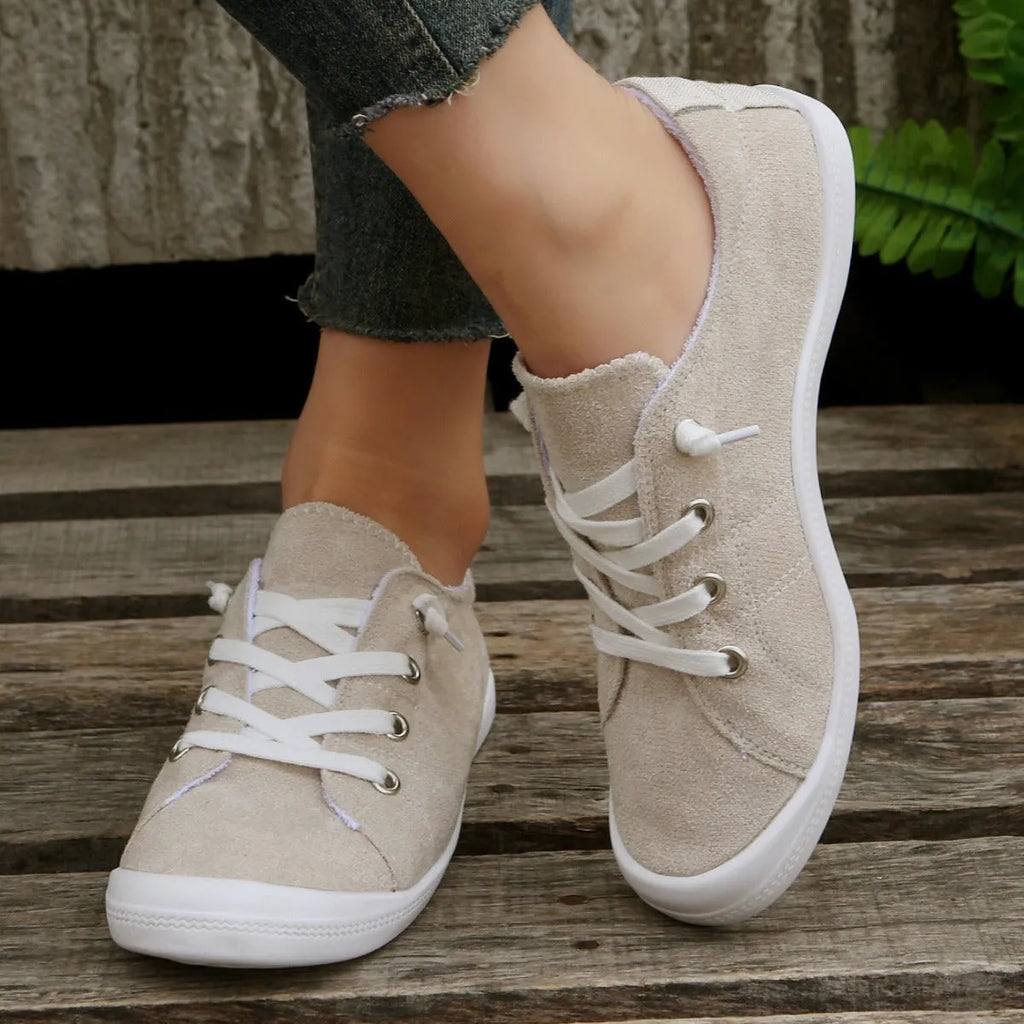 Women's creamy white fabric casual sneakers with low-top design and rubber sole