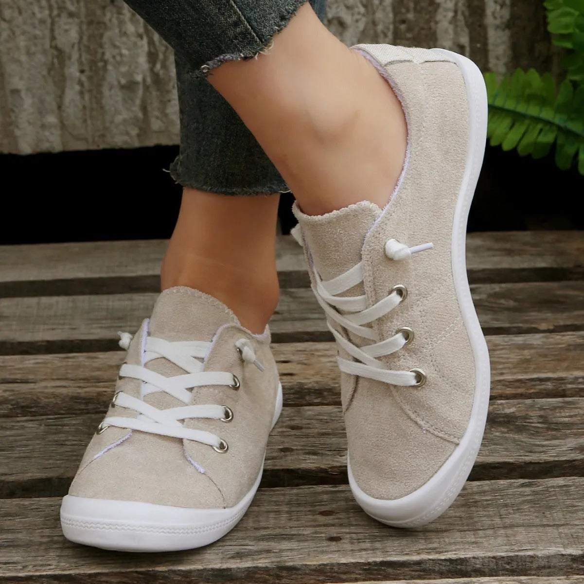 Women's creamy white fabric casual sneakers with low-top design and rubber sole