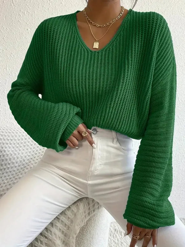 Women's solid colour long sleeve polyester pullover in a loose casual fit.