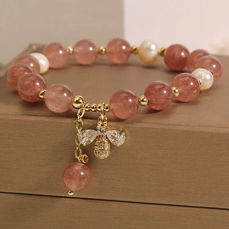 Women's alloy bracelet with three strawberry quartz stones, freshwater pearls, and zircon accents.
