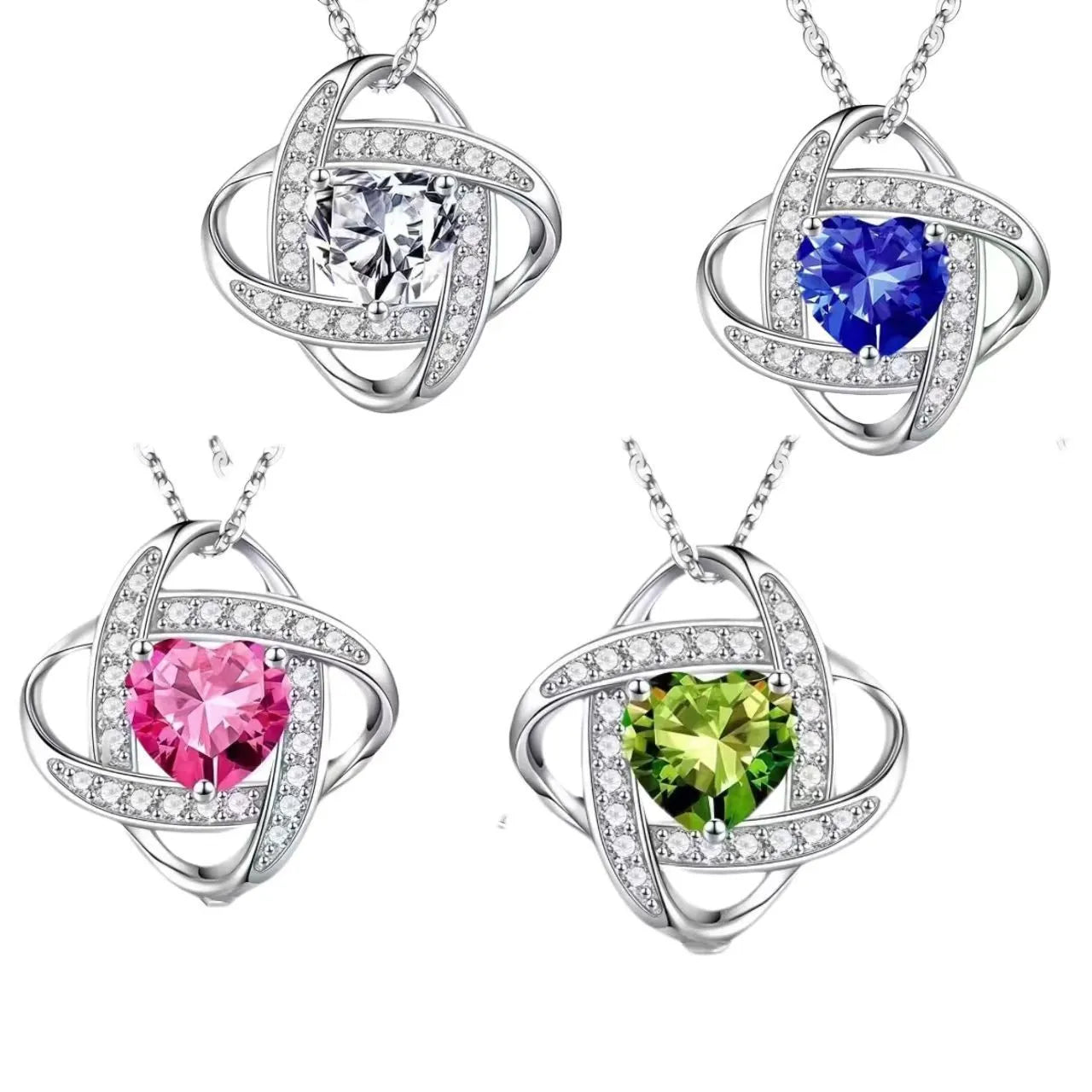 Close-up of a ladies heart-shaped love necklace pendant in a platinum colour finish on a model.