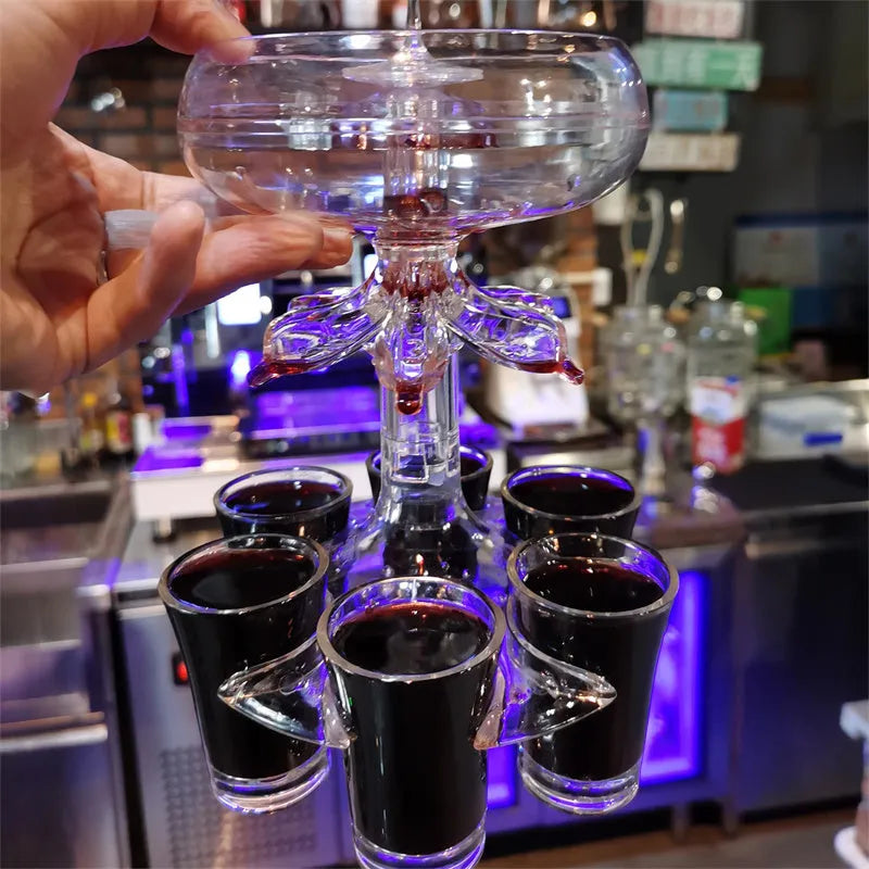 Transparent Plexiglass 6-shot glass dispenser rack holding six cups on a stand.