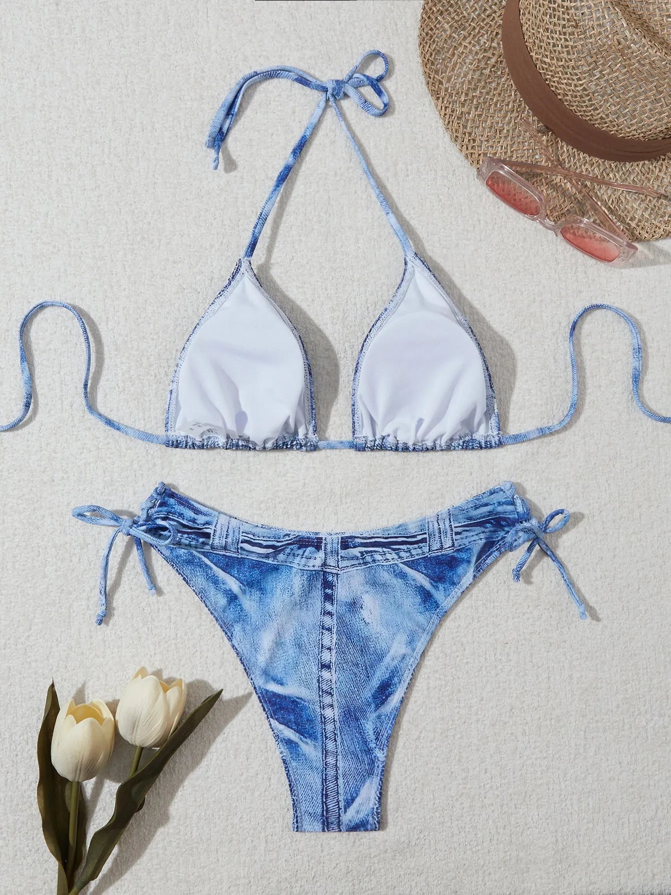 Denim blue printed women's bikini set with strap design on a mannequin.