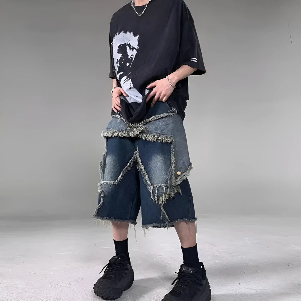 Blue denim shorts with frayed five-pointed star detailing and loose retro styling