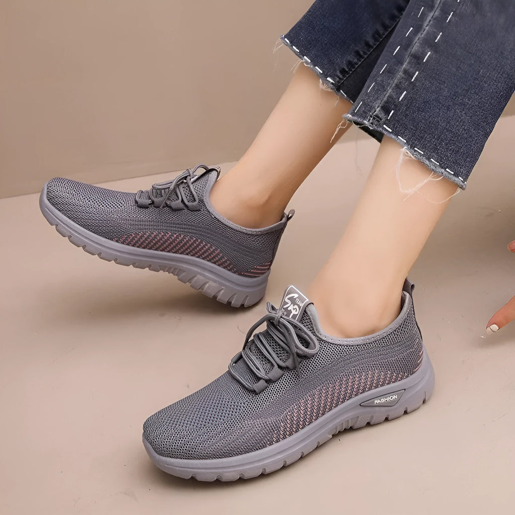 Women's mesh breathable casual sneakers in black with cross strap design and round toe