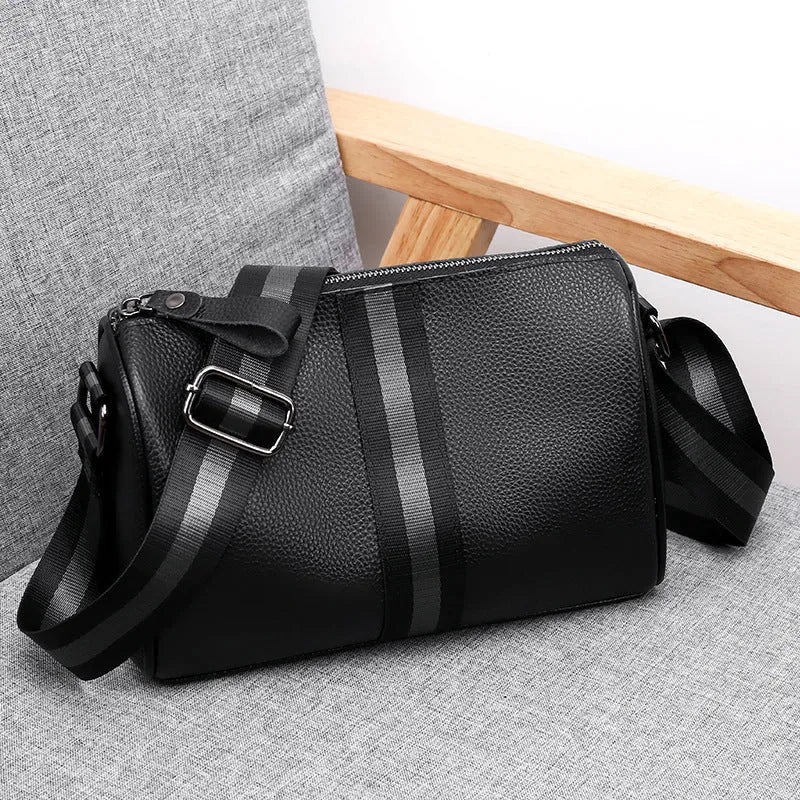 Black genuine leather one-shoulder crossbody bag with a single strap.