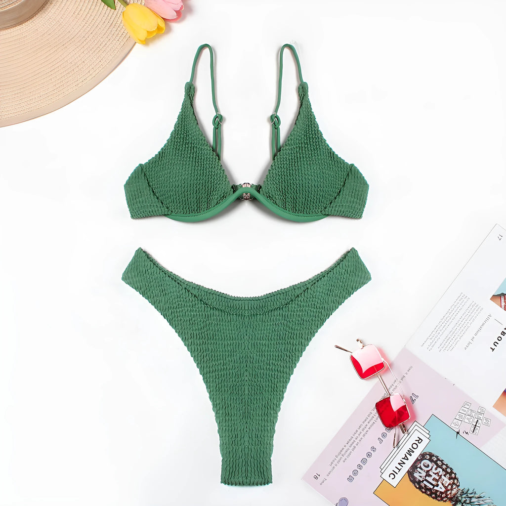 Green women's bikini set with ruffle trim, showing top and split briefs made from quick-dry polyester fabric.