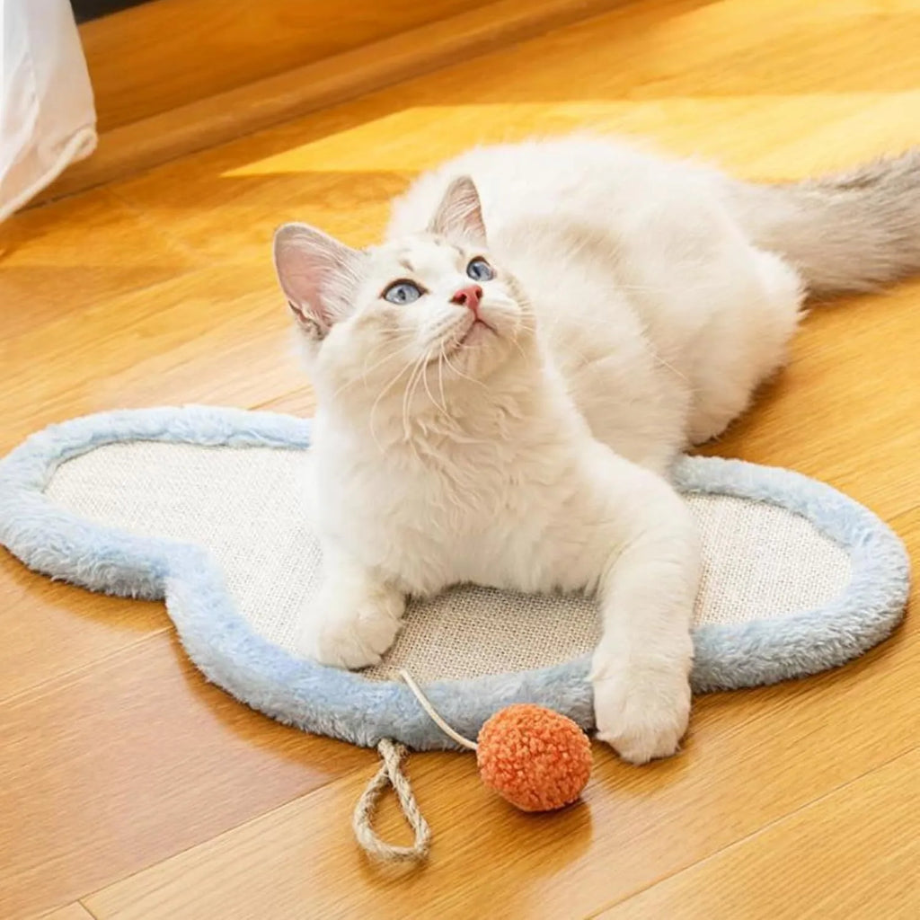 White cat scratching mat with natural sisal surface featuring sleeping cat cartoon design