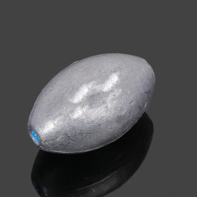 Tongxin olive lead fishing sinker with scale markings, showing rugby shape and plastic core.